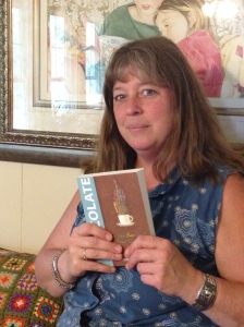 Local artist, Sandra Waugh, with the book cover she designed for author Elizabeth Hamilton-Guarino and Hay House Publishing.